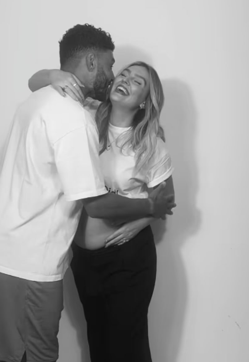 Alex Oxlade-Chamberlain alongside Perrie Edwards in shared reveal