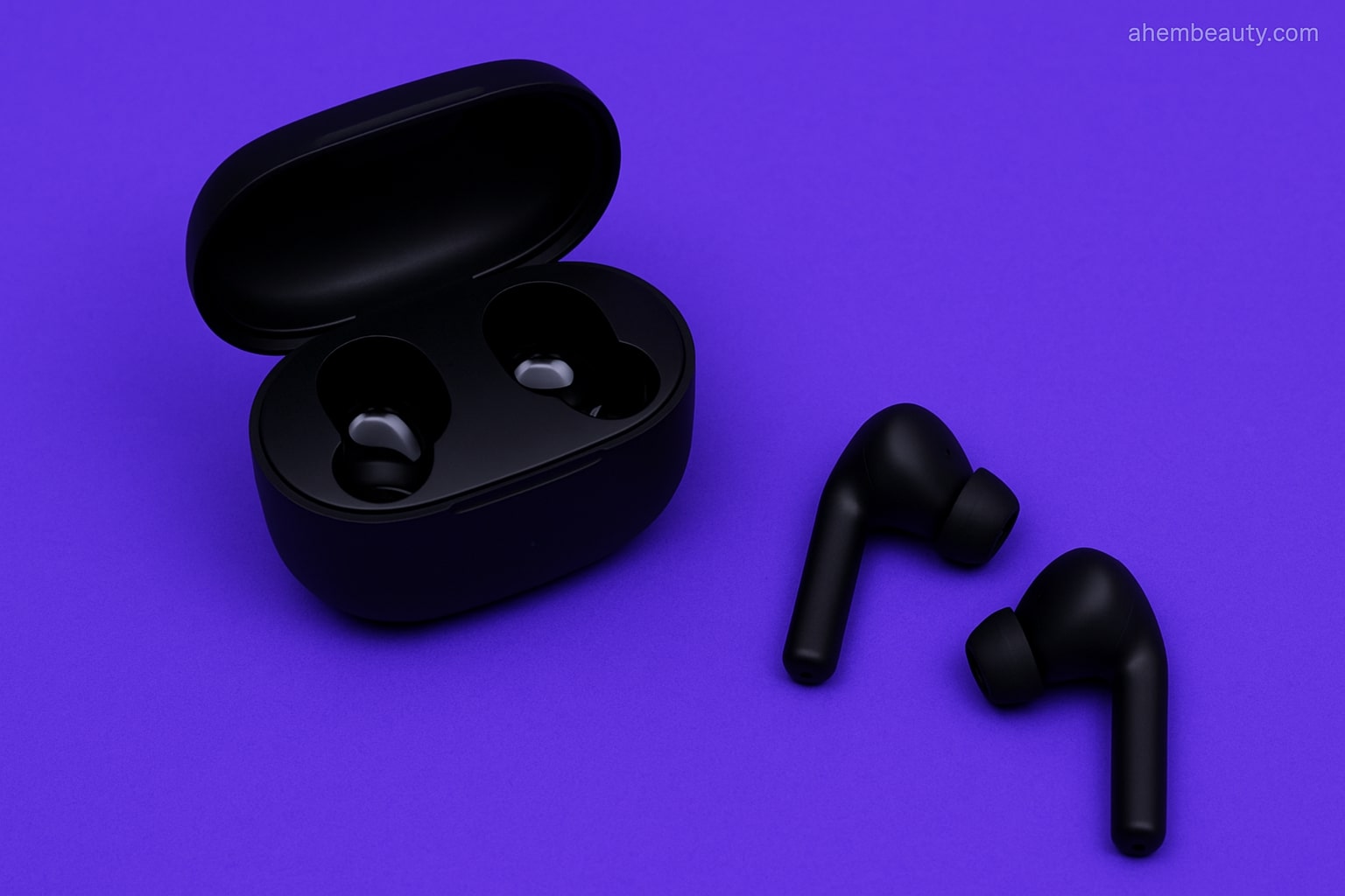 Budget wireless earbuds arranged neatly on an Iris background